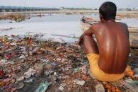 Waste collecting on the side of a river