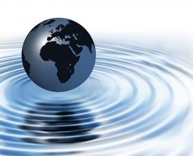 globe above ripples of water